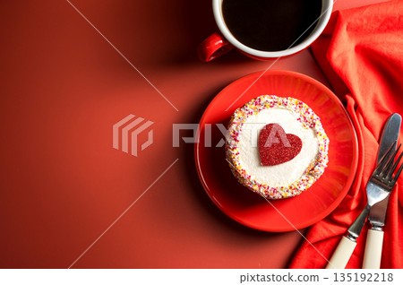 Valentine's Day, Festive red background. Cake with red heart and cup of coffee. Top view with copy space 135192218