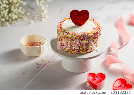 Valentine's Day, Love, festive cake with red heart and gypsophila flowers Valentine's Day, Love, festive cake with red heart and gypsophila flowers 135192225