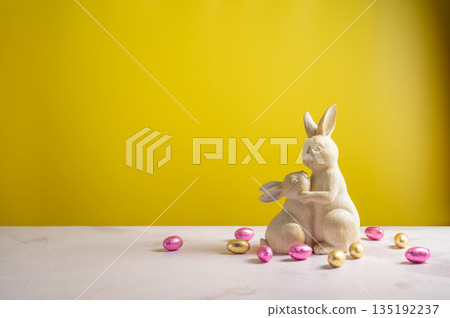 Easter background, greeting card with chocolate eggs, cute bunnies. Spring holiday background 135192237
