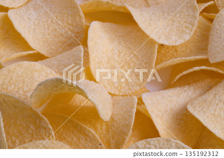 Elegant snack surface, Continuous golden curves in neutral salttoned snack pattern, Repeating potato chip motif with subtle salt accents perfect for packaging visuals Elegant snack surface, Continuous golden curves in neutral salttoned snack pattern, Repeating potato chip motif with subtle salt accents perfect for packaging visuals 135192312