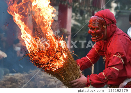Nagata Shrine Traditional Oinashi Ceremony: Red demon holding a torch 135192579