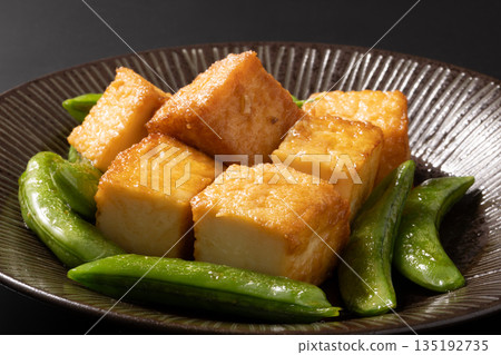 Stir-fried snap peas and deep-fried tofu Stir-fried snap peas and deep-fried tofu 135192735