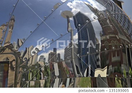 Some buildings of Brisbane as a reflection in the hull of a food truck 135193005