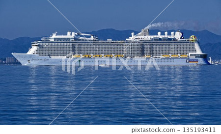 Luxury cruise ship Spectrum of the Seas sailing through Hakata Bay in the morning 135193411