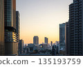 Cityscape with sunset sky and skyscrapers 135193759