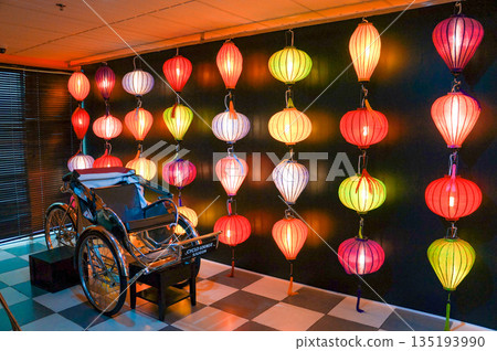 A wall decorated with the famous colorful lanterns of the small Vietnamese town of Hoi An A wall decorated with the famous colorful lanterns of the small Vietnamese town of Hoi An 135193990