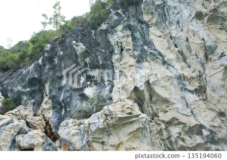 Exposed rock cliffs in Halong Bay Exposed rock cliffs in Halong Bay 135194060