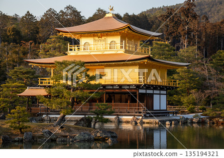 Kinkakuji Temple shining in the sunset Kinkakuji Temple shining in the sunset 135194321