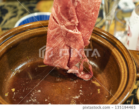 Premium marbled Wagyu beef grilled in a clay pot with a fragrant sauce Premium marbled Wagyu beef grilled in a clay pot with a fragrant sauce 135194465