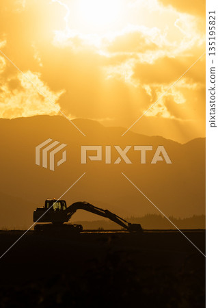 [Autumn evening] Countryside landscape _ Sunset and working vehicles 135195821
