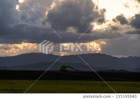[Autumn evening] Countryside landscape _ Sunset and working vehicles 135195840