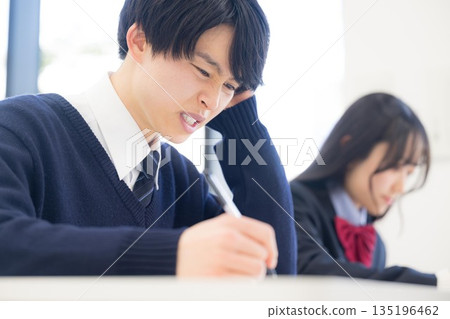 High school boy struggling with studying for exams and learning: He can't understand classes or tests at all... High school boy struggling with studying for exams and learning: He can't understand classes or tests at all... 135196462