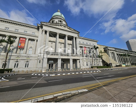 The National Gallery Singapore showcases neoclassical grandeur with Corinthian columns, a central dome, and art banners, blending colonial heritage, culture The National Gallery Singapore showcases neoclassical grandeur with Corinthian columns, a central dome, and art banners, blending colonial heritage, culture 135198122