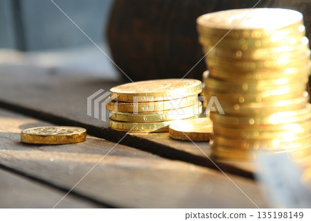 Golden coins on retro background. Golden coins on retro background. 135198149