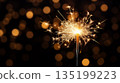 Sparkler that is lit up in the dark. Celebrations sparkler with night lights. A sparkler is lit 135199223