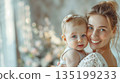Happy mom with baby. woman holding a newborn baby 135199233