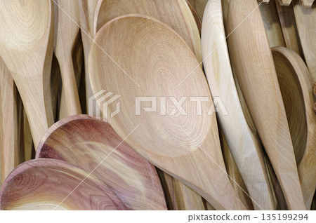 A large group of handmade wooden spoons A large group of handmade wooden spoons 135199294