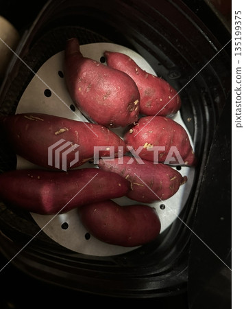 Steamed sweet potatoes, naturally sweet and soft with a rich, earthy flavor. Perfect as a healthy snack or side dish, enjoyed for their comforting warmth and nutritious value. 135199375