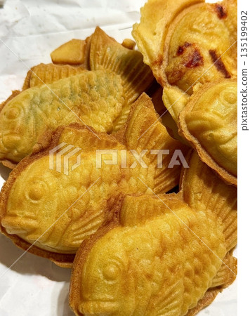 Bungeoppang, bungeo-ppang (Korean Fish Shaped Pastry), popular snack, cookies, sweet in winter streets of Korea. Bungeoppang Korean traditional national food, dish, cuisine. Japanese taiyaki Bungeoppang, bungeo-ppang (Korean Fish Shaped Pastry), popular snack, cookies, sweet in winter streets of Korea. Bungeoppang Korean traditional national food, dish, cuisine. Japanese taiyaki 135199402
