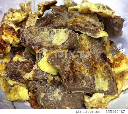Savory and crispy gogi jeon, Korean-style meat pancakes made with seasoned minced meat and a golden, pan-fried coating. A delicious and flavorful dish, perfect as a side or snack! 135199487