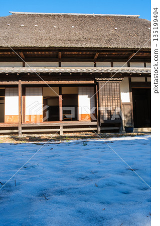 Thatched roof and snowy landscape Thatched roof and snowy landscape 135199494