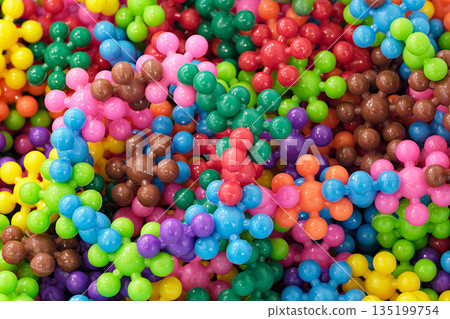 Colorful bright plastic parts from a children's construction set 135199754