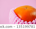 Shiny and richly sweet, the Fuyu persimmon has a vibrant warm orange color. 135199781
