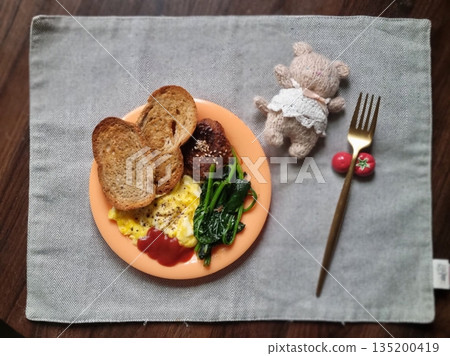 A delightful brunch spread featuring a mix of savory and sweet dishes, including fresh pastries, eggs, seasonal fruits, and a hot beverage. A perfect mid-morning indulgence. A delightful brunch spread featuring a mix of savory and sweet dishes, including fresh pastries, eggs, seasonal fruits, and a hot beverage. A perfect mid-morning indulgence. 135200419