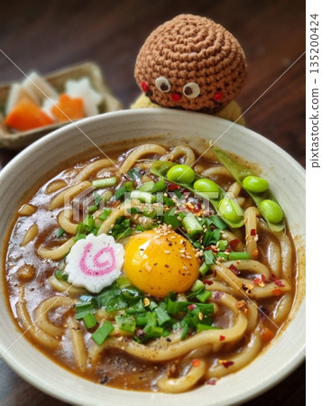 Thick, chewy udon noodles in a rich and savory Japanese curry sauce, topped with green onions and your choice of protein. A comforting dish with bold, hearty flavors. 135200424