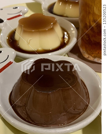 Soft and silky mini pudding served in a petite cup, with a melt-in-your-mouth texture and a delicate sweetness. A charming bite-sized treat perfect for any time of the day. 135200523
