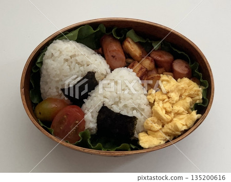 Traditional Korean dosirak lunchbox, neatly packed with rice, kimchi, stir-fried veggies, and protein. A wholesome and flavorful meal, ideal for enjoying authentic Korean flavors on the go. Traditional Korean dosirak lunchbox, neatly packed with rice, kimchi, stir-fried veggies, and protein. A wholesome and flavorful meal, ideal for enjoying authentic Korean flavors on the go. 135200616