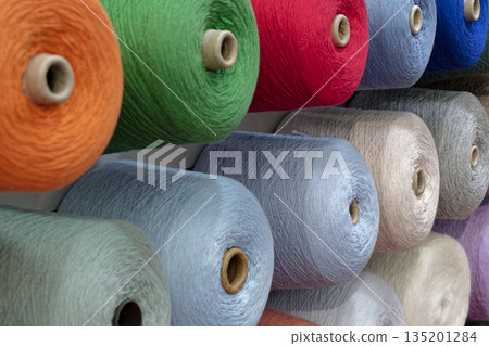 Spools of multi-colored wool threads Spools of multi-colored wool threads 135201284