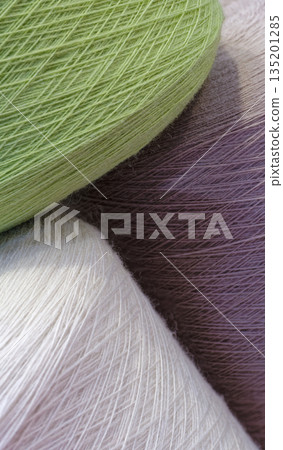 Spools of multi-colored wool threads Spools of multi-colored wool threads 135201285