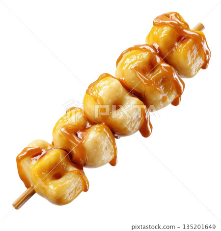 Sweet sticky rice dumplings on wooden skewer covered with glossy caramel sauce, offering delicious and tempting dessert treat 135201649