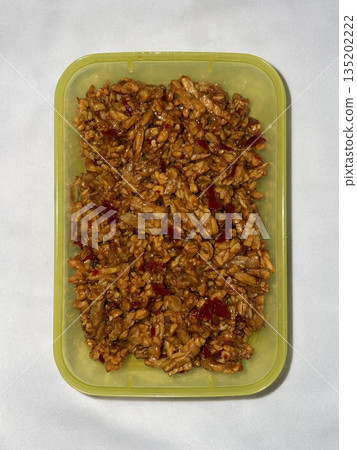 Sambal tempe made with crispy fried tempeh mixed in spicy chili sauce, combining savory and spicy flavors with a rich texture for a bold and flavorful traditional Indonesian dish 135202222