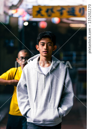 Junior high school students walking down an alley 135202270