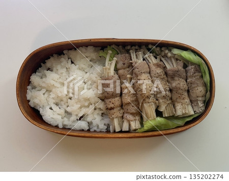 A traditional Korean dosirak, beautifully arranged with rice, assorted banchan, and savory proteins. Balanced and visually inviting, it’s a portable meal packed with vibrant flavors. 135202274