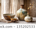 antique vase and dried flowers 135202533
