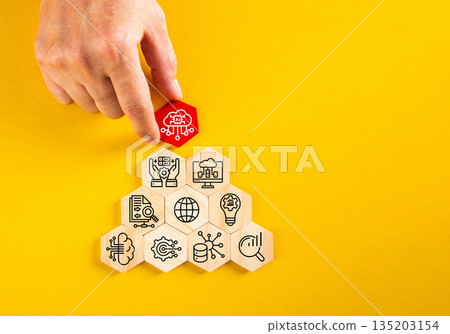Hand placing ai cloud computing hexagon on technology stack Hand placing ai cloud computing hexagon on technology stack 135203154