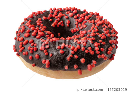 Single donut decorated with dark chocolate icing and red sprinkles 135203929