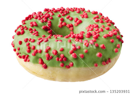 Single donut decorated with green icing and red sprinkles Single donut decorated with green icing and red sprinkles 135203931