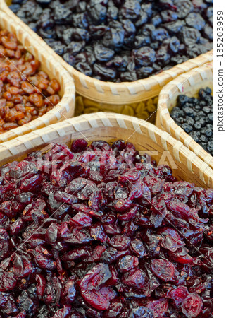 Dried forest berries in a baskets 135203959