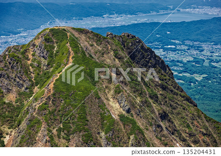 Mt.Amidadake and Lake Suwa seen from the Yatsugatake mountain range and the summit of Mt.Akadake Mt.Amidadake and Lake Suwa seen from the Yatsugatake mountain range and the summit of Mt.Akadake 135204431