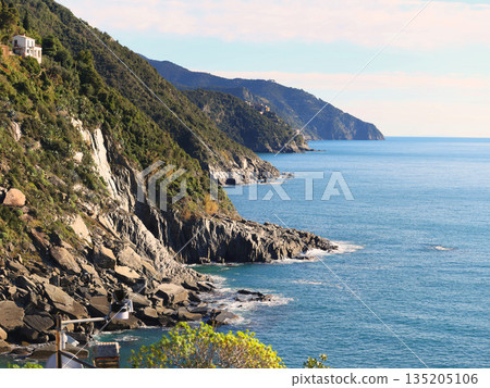 Rocks and sea, Cinque Terre mountains, Italy. Nature and clear blue waters of Mediterranean Sea. Peace and quiet. Vernazza ecology. Background for design. 135205106
