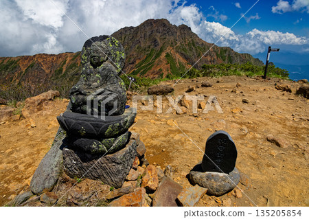 View of stone Buddha and Akadake at the summit of Yatsugatake mountain range and Amidadake View of stone Buddha and Akadake at the summit of Yatsugatake mountain range and Amidadake 135205854