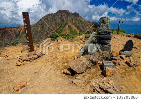 View of stone Buddha and Akadake at the summit of Yatsugatake mountain range and Amidadake View of stone Buddha and Akadake at the summit of Yatsugatake mountain range and Amidadake 135205860