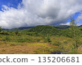 Maimenoike Pond in Norikura Highlands and the sea of clouds over the Norikura mountain range (Matsumoto City, Nagano Prefecture) 135206681