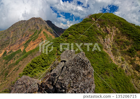 View of the Yatsugatake mountain range, Mount Amida and Mount Akadake from the descent of the Ogoya Ridge 135206715