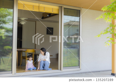 Family looking out the window Family looking out the window 135207289