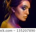 Creative art makeup. Close-up studio portrait of young fashion model 135207890
